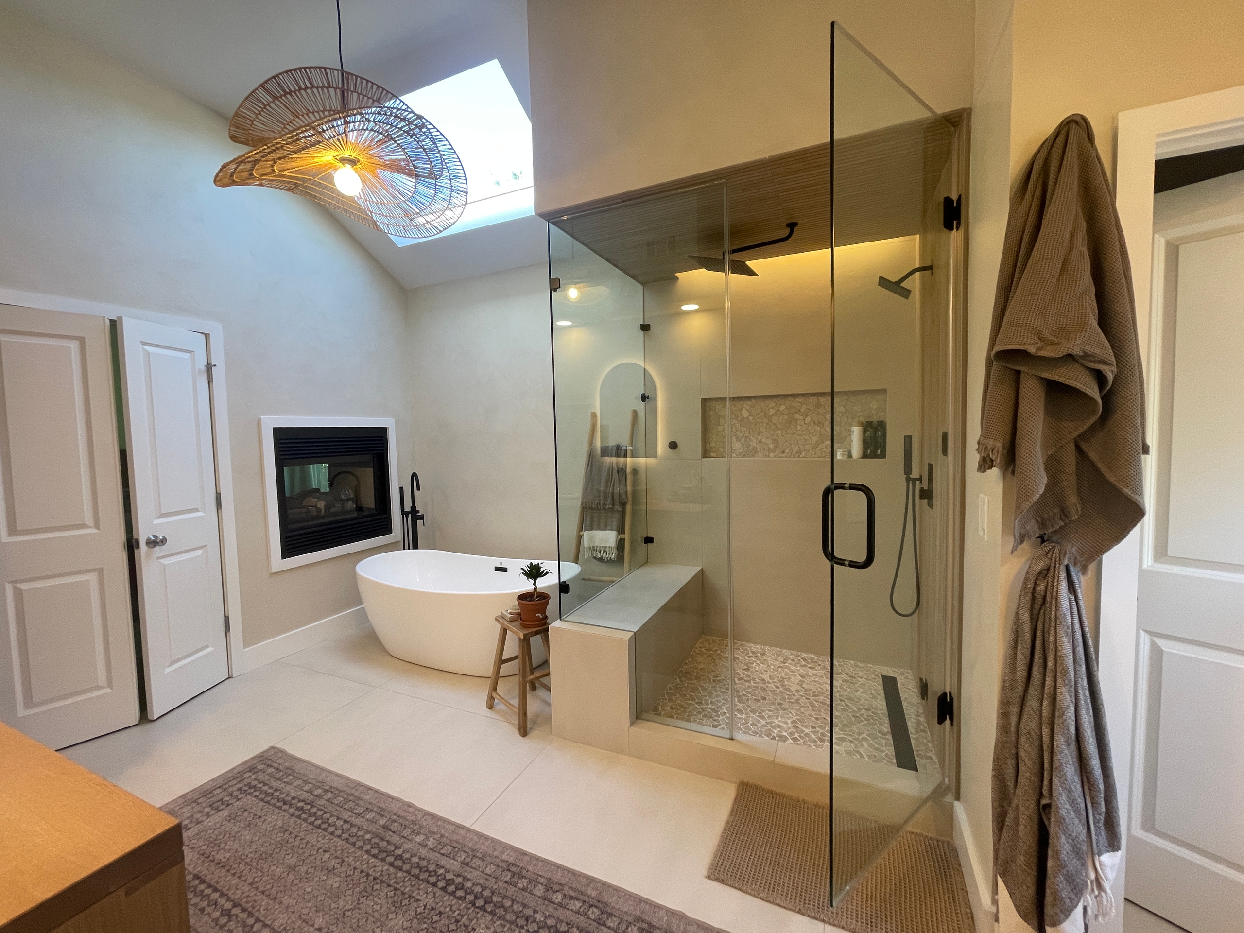 Primary bath with a freestanding tub and glass shower