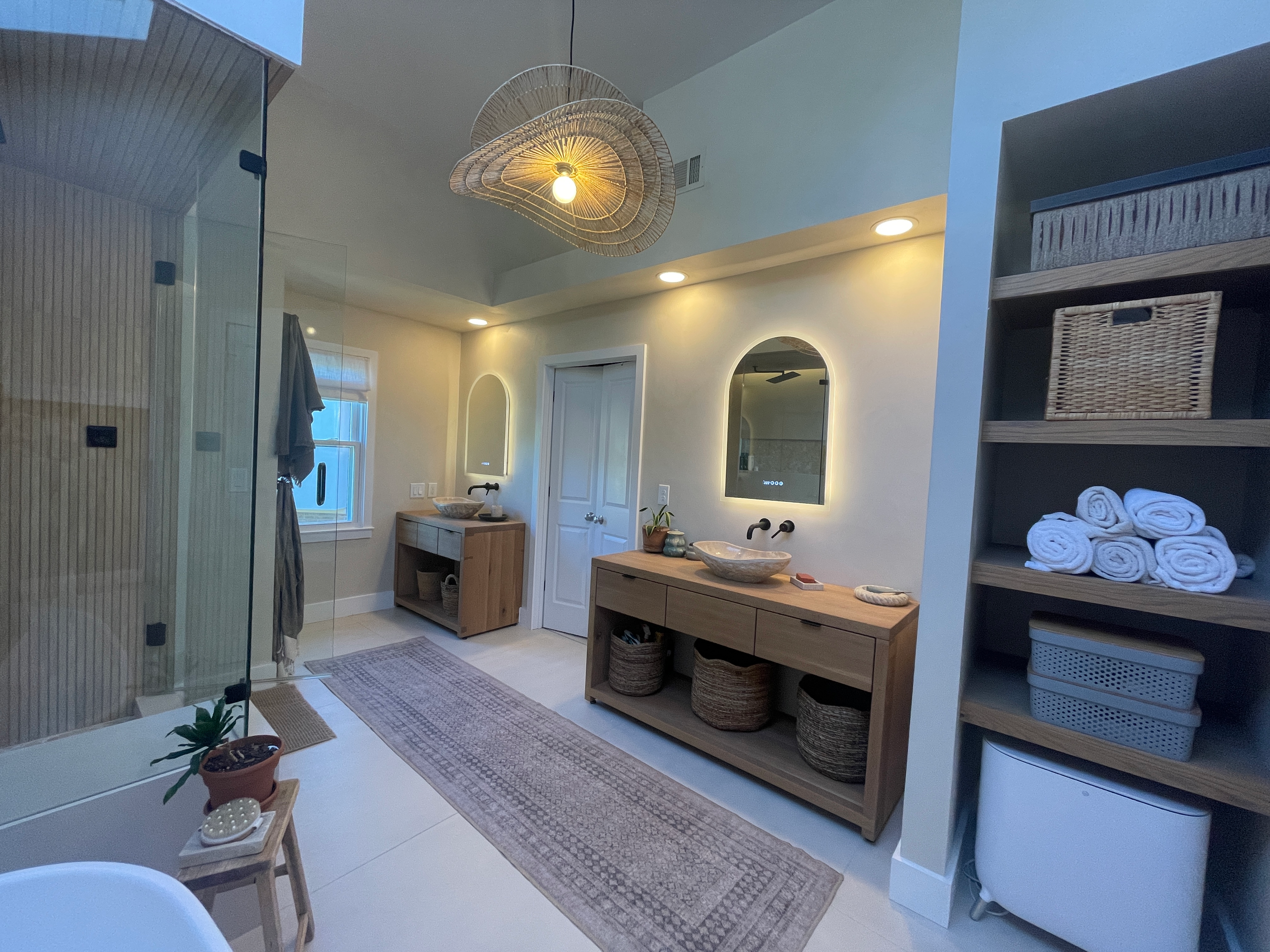 Shower fixtures and tile in the renovated primary bath